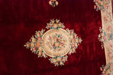 Japanese Savonnerie carpet with deep black cherry red field, rose bouquets, and scrolling border.