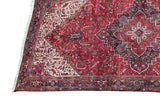 Stepped ivory spandrel and detailed navy border on a cherry red vintage Persian Mehrivan carpet.