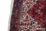 Full wool pile and intact side cord selvage on a vintage Mehrivan rug with a geometric navy border.