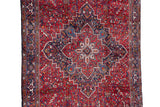 Concentric stepped medallion with geometric vinery in navy, sky blue, and cherry red.