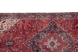 Intricate geometric border and ivory-outlined stepped medallion on a vintage Persian Mehrivan carpet.