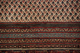 Persian Mir Sarouk rug detail: ivory boteh field transitions to vibrant red, blue, blush patterned borders.