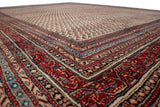 Vintage Mir Sarouk carpet's corner with cherry red, navy borders and ivory field's diminutive botehs.