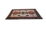 Vintage Meshkin carpet: geometric medallions, boteh, bird motifs, ivory field, rust border.