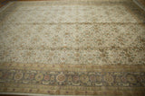 Agra carpet's Herati main border featuring dusty oxidized green, gold, and red floral motifs.