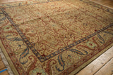 Low angle on the vintage carpet showing the high luster wool and scrolling floral borders.