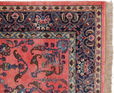 Vintage Indian Mohajeran Sarouk rug corner, navy boteh border, ruby red field, fringe.