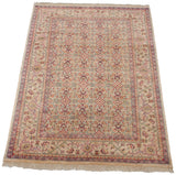 Angled perspective of a vintage Indian Mahal carpet highlighting its lustrous, full wool pile.