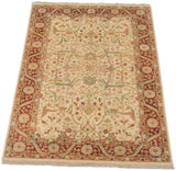 Corner of vintage Indian Bijar rug: terra cotta floral main border and ivory field arabesques.