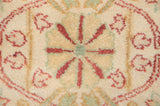 Vintage Indian Bijar rug pile featuring ivory, celadon, saffron floral arabesques and original height.