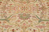Indian Bijar design detail: classic floral arabesques in celadon, terra cotta, saffron on ivory.