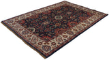 Ivory border with splayed medallions contrasts dusty navy field, Indian Sultanabad rug.