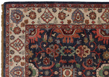 Sultanabad vintage rug corner, dusty navy field, ivory border, floral arabesque vinery.