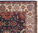 Upper right corner of vintage Indian Sultanabad carpet, dusty navy field, ivory border, floral motifs.