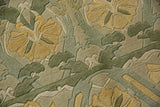 Embossed Indian Arts and Crafts floral design with carved relief in sea foam green and saffron yellow.