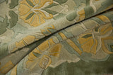 Plush embossed wool pile on the Indian Arts and Crafts rug with sea foam green and saffron yellow.