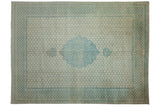 Vintage distressed Bulgarian Tabriz carpet with a scalloped blue medallion on an ivory field with an allover lattice pattern and floral borders.