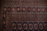 Detailed view of the vintage Bokhara's gul medallions and intricate multi-row geometric borders.