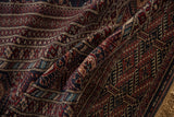 Soft folds display the fine, lustrous wool pile of a traditional Bokhara carpet.