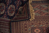 The hand-knotted construction of a vintage Bokhara, showing the fine back weave and plush pile.