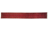 Cherry red vintage Bokhara runner, plush hand knotted with repeating gul medallions.