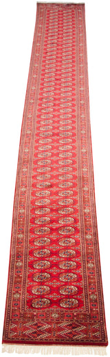 Cherry red Bokhara runner with repeating geometric gul medallions, fine borders.