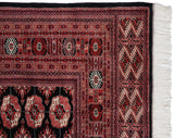 Intact side cord selvage and clean ivory fringe on a vintage fine Bokhara carpet with detailed geometric borders.