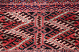Detailed view of the fine hand-knotting and plush pile on a vintage Bokhara gul medallion.