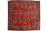 Detailed repeating gul medallions in a fine weave across a cherry red vintage Bokhara carpet.