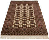 Fine Bokhara rug viewed from an angle, showing its lustrous pile and repeating gul medallions.