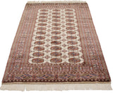 Angled perspective of a fine Bokhara rug, emphasizing the lustrous wool and repeating gul medallions.