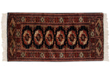 Vintage fine Bokhara runner, repeating gul medallions in black, rust, and ivory. 2' x 4'5