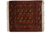 Vintage Bokhara square rug with fine repeating gul medallions in dusty rose and navy.