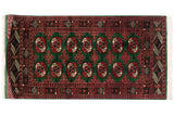 Vintage Bokhara rug featuring columns of red and ivory gul medallions on a deep green field.