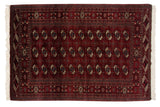 Vintage Fine Bokhara rug with repeating gul medallions in a wine red, navy blue, and ivory palette.