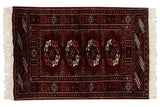 Vintage Bokhara rug mat with repeating gul medallions in wine red, navy blue, and ivory.