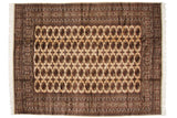 Vintage fine Bokhara carpet with repeating elephant footprint guls in bronze and navy on a plush ivory ground.