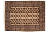 Repeating columns of detailed gul medallions on a vintage ivory Bokhara carpet.