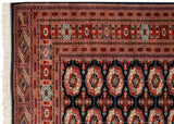 Intricate geometric borders and intact side cord selvage on a vintage fine Bokhara carpet.