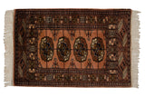 Fine vintage Bokhara rug mat with plush dusty rose field and elephant footprint medallions, 2' x 3'2
