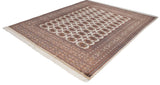 High-angle view of a vintage Bokhara carpet highlighting its plush, lustrous pile and geometric gul pattern.
