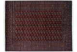 Fine vintage Bokhara carpet in rich wine red with repeating elephant footprint medallions.