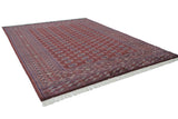 Plush wine red Bokhara carpet with gul medallions, geometric borders, and ivory fringe.