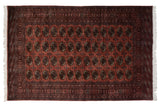 Fine vintage Bokhara carpet, dusty rose field with navy elephant footprint medallions, lustrous pile.