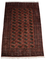 Vintage Bokhara carpet with fine weave, lustrous dusty rose field and detailed gul medallions.