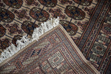 The tight, fine hand-knotted weave seen on the back of a vintage Bokhara rug.