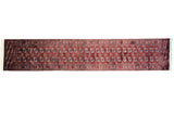 Vintage Bokhara rug runner with repeating gul medallions in wine red, navy blue, and ivory.