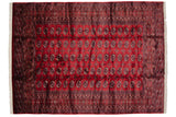 Lustrous cherry red pile of a fine vintage Bokhara carpet with rows of detailed gul medallions.