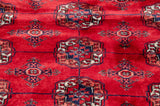 High sheen and tight weave of a plush Bokhara carpet in cherry red and navy blue.