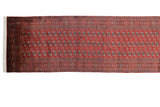 Fine weave and detailed gul medallions on a cherry red Bokhara runner with clean ivory fringe.